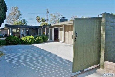 Gated entry to driveway and courtyard