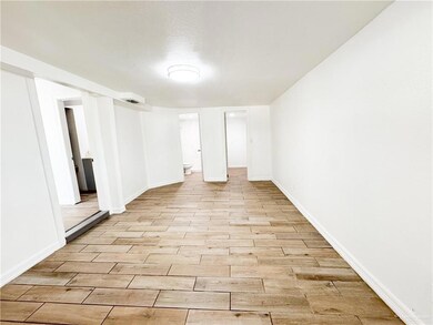 Unfurnished room with light hardwood / wood-style flooring