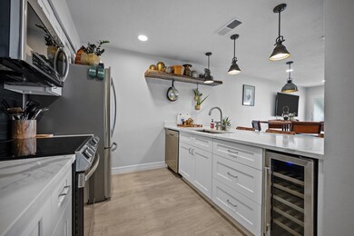 Kitchen has new appliances including a wine fridge