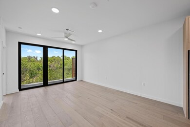 Living room with ceiling fan and wood finished fl