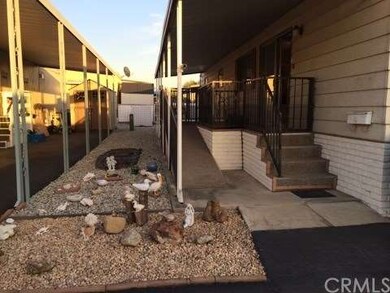 Side yard and entry to this nice home. It does hav