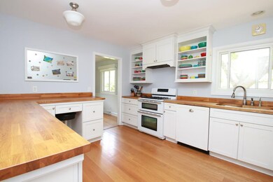WOW! White cabinetry and butcher block countertops