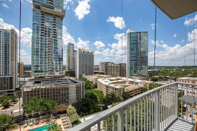 Balcony featuring a view of city
