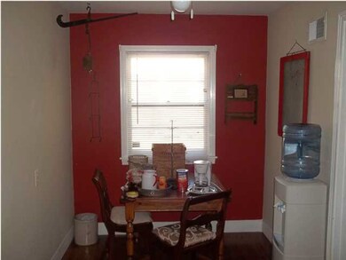 Dining area in the kitchen with large window for n