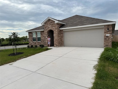Ranch-style house with brick siding, driveway, an
