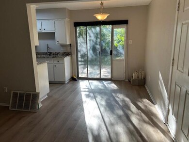 Informal dining area with easy kitchen access and view of back yard.