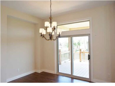 Elegantly hung Chandelier Enhances the Dining Room