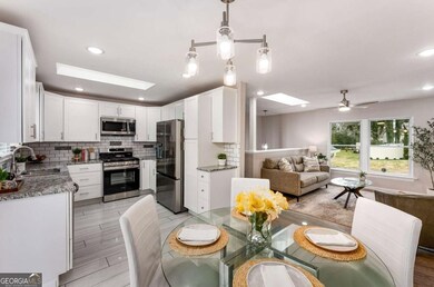 Bathed in sunlight, the kitchen and dining area is