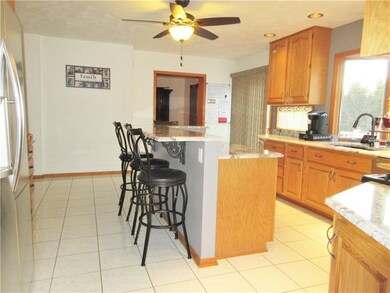 Kitchen: Island with sitting for 4, new fixtures.