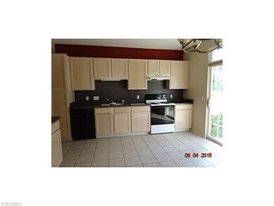 Kitchen with ceramic tile flooring and built in ap