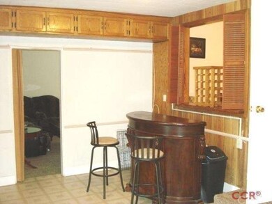 Combination den and utility room.