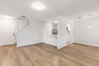 Unfurnished living room featuring light wood-styl