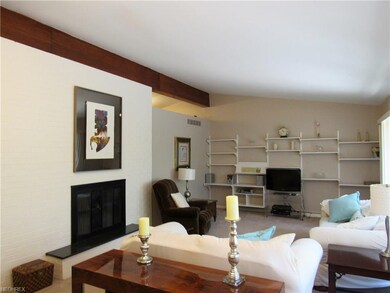 Opposite of the fireplace is walls of windows