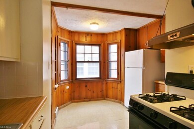 Efficient kitchen with charming eat-in area.