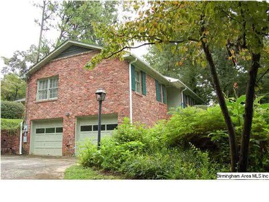 It has a two car side-entry garage with large turn