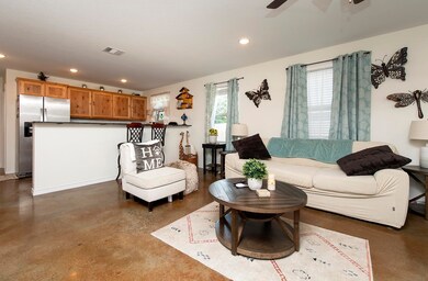 A large breakfast bar separates the kitchen from the dining, ideal for serving guests.
