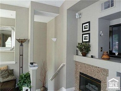 Fireplace and the stairs up