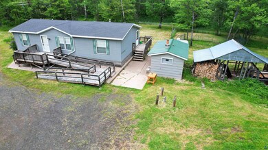 Exterior space featuring a shed and a deck