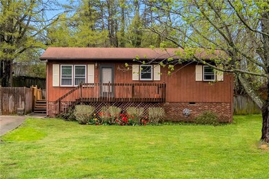 The front porch invites you in!  Also, note the side deck entry from the driveway and a fully fenced back yard.