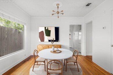 Dining area with wood finished floors and baseboa