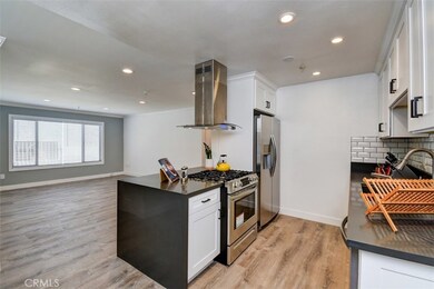 Newly remodeled kitchen opens to the living room.