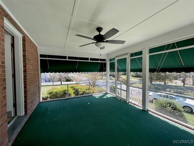Unfurnished screened porch with a ceiling fan
