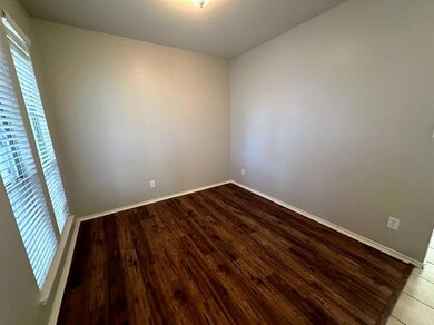Unfurnished room with hardwood / wood-style flooring
