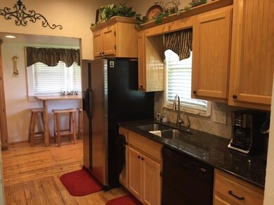 Updated kitchen with granite counters and tiled ba