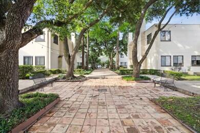 Tree lined court yard with large trees. 36 unit co