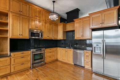 Stainless Frigidaire stove, microwave, and refrige