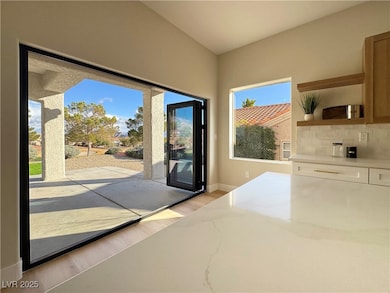 Doorway to outside with light wood-style flooring