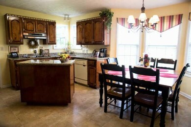 The Eat-In Kitchen offers Granite Counter Tops and Like-New Cherry Cabinets