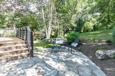 Relax on the deck off the kitchen or in the beautiful stone patio area.