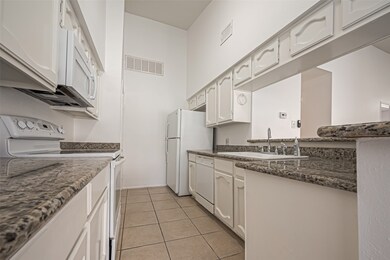 Step into the kitchen, which features all the esse