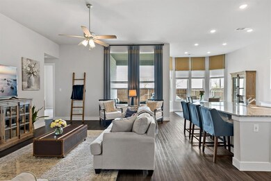 Open living, kitchen and breakfast areas with abundant natural light.