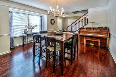 Large dining room with a bump out window, chair ra