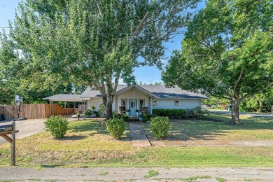 Ranch-style home featuring a front yard