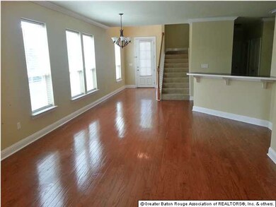Living area with adjoining dining.