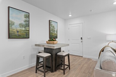 Dining room featuring light wood finished floors and recessed lighting