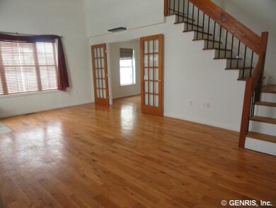 Living Room. Open stairway leading to the loft / b