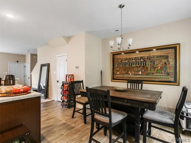 Dining room with light hardwood flooring