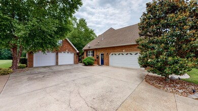 2 car attached garage and a 2 car detached garage with storage above.
