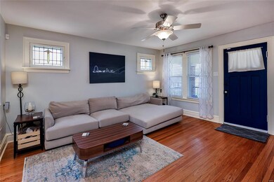 View of front entry and original stained glass windows.