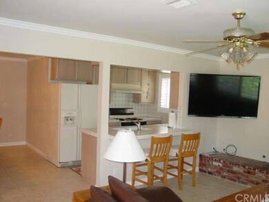 view of kitchen breakfast counter from family room