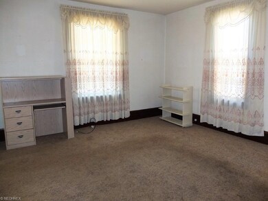 Formal living room with newer carpet.