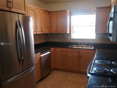 This beautiful kitchen overlooks the private fenced courtyard out front.