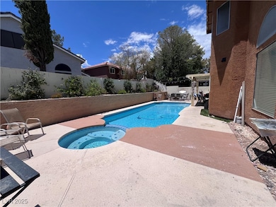 View of swimming pool featuring a fenced backyard,