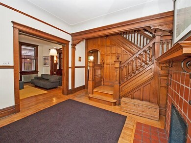 Amazing foyer with original woodwork.