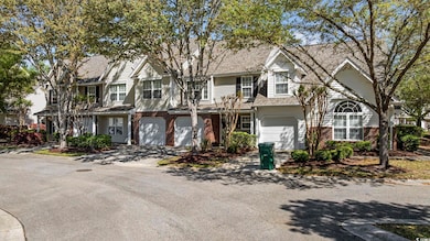 Multi unit property with driveway, brick siding, a