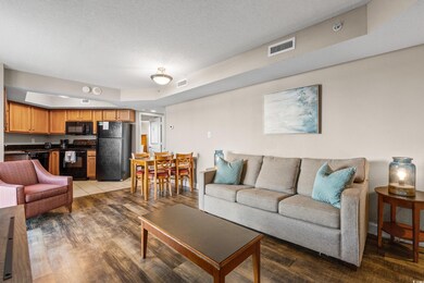 Living area featuring visible vents, a textured ce